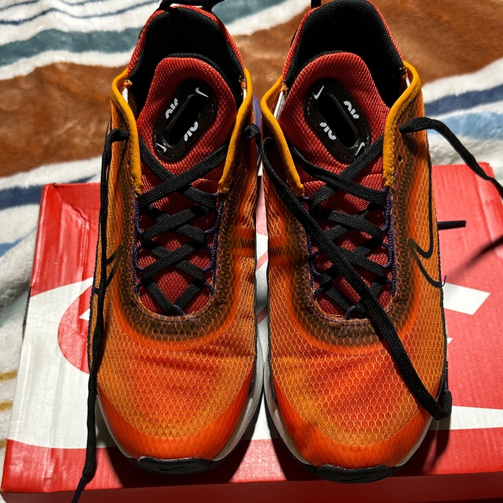 Nike women’s Orange and Black Athletic Running Shoes
